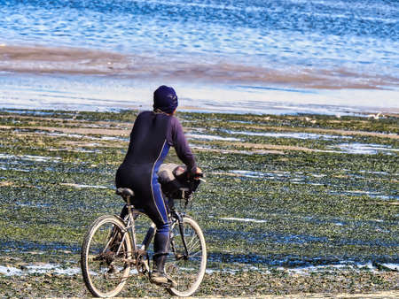 Going to the beach by bike after fishingの写真素材