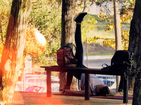 Person exercising in the park on an autumn dayの写真素材