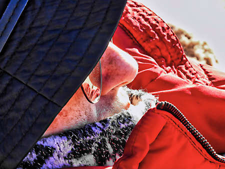 Profile of woman with black hat with nose detailの写真素材