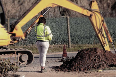 The young engineer supervising the work on siteの写真素材