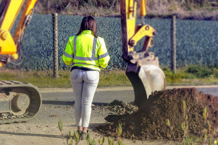 The young engineer supervising the work on siteの写真素材