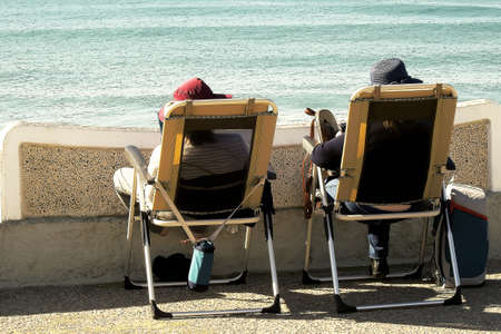 Tourists enjoying a sunny winter day on the Atlantic coastの写真素材