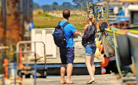 Pair of tourists on the seafront on holiday