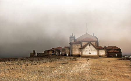 An old abandoned monastery covered in fogの写真素材
