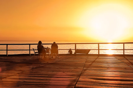 People enjoying the spectacle of the sunset at the Atlantic ocean
