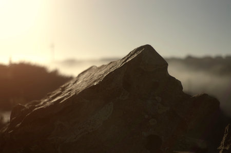 The top of a rock in the foreground with a blurred backgroundの写真素材