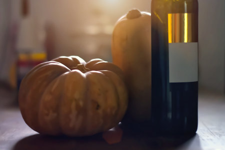 Still life with pumpkins and a bottle of wine with the light behind