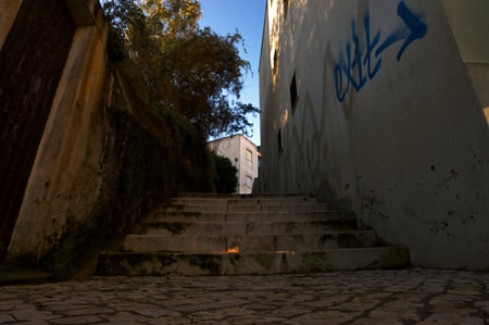 View from a street with a staircase in the shadeの写真素材