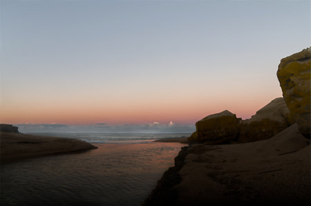 Seascape with a beach before sunriseの写真素材