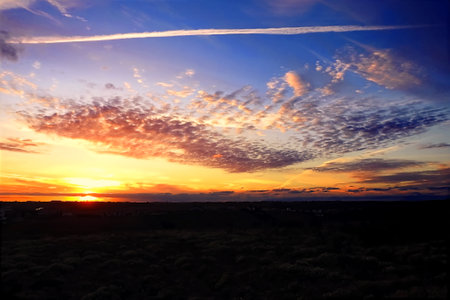 Rural landscape at sunset with defined cloudsの写真素材
