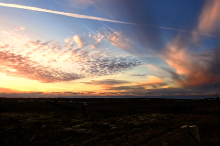 Rural landscape at sunset with defined cloudsの写真素材