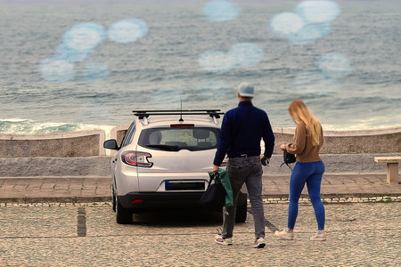 A couple walking towards their car in the parking lotの写真素材