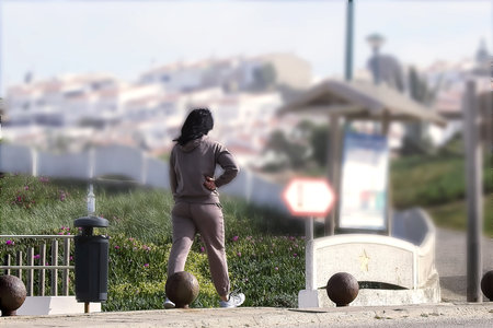 Woman in sports equipment walking in the morningの写真素材