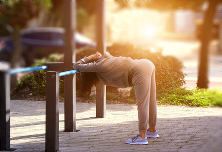 Women doing gymnastics in the park in the morningの写真素材