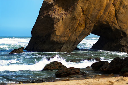 Seascape with a rock in the ocean on a windy dayの写真素材