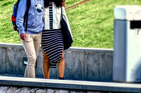 Passersby walking on a street through the cityの写真素材