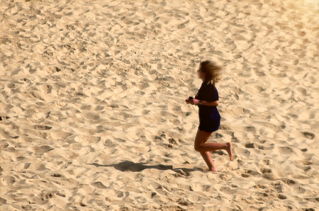 In solitary activity on the sand of a beachの写真素材
