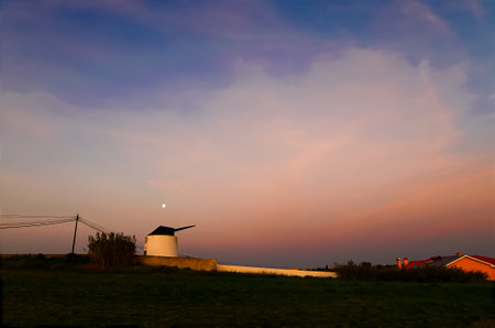 View of an old windmill before sunriseの写真素材