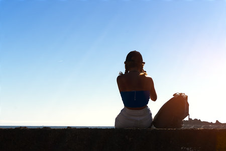 Alone at the seaside admiring the oceanの写真素材