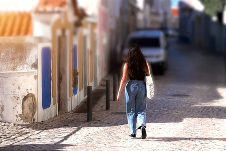 Passersby on a street on a sunny dayの写真素材