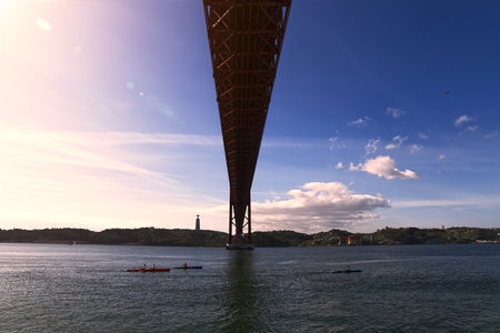 View from under a bridge on the river bankの写真素材