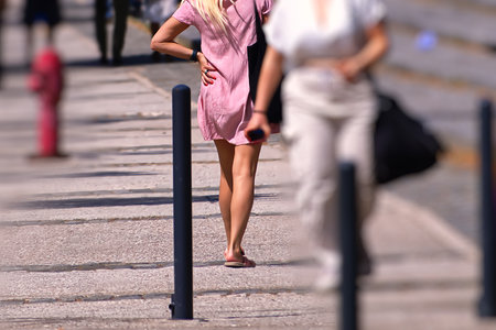Passersby on a street on a sunny dayの写真素材