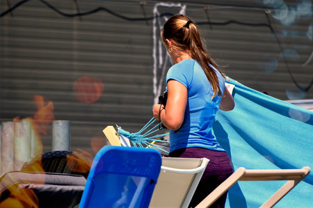 Woman in purple tights at a summer exhibitionの写真素材