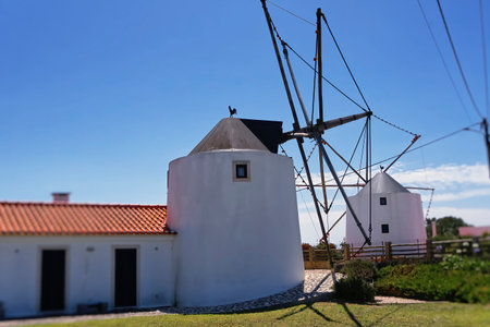 An old refurbished Portuguese windmillの写真素材