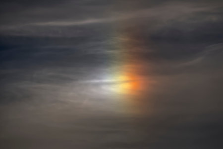Sunset in the sky with clouds and rainbow. Selective focus.の写真素材