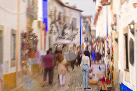 People walking on the street in Obidos, Portugal