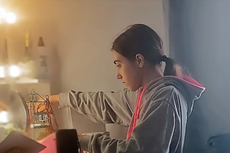 Young woman working on laptop at home. Work from home concept.の写真素材