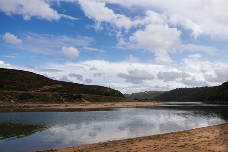Beautiful landscape of the river and blue sky with white clouds.の写真素材