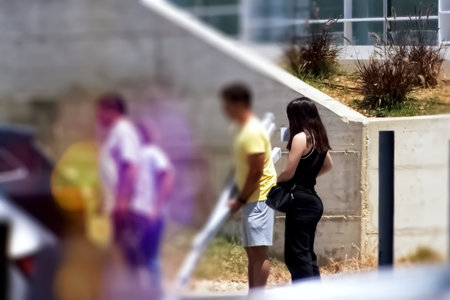 Group of people walking in the city. Back view. Blurred background.の写真素材