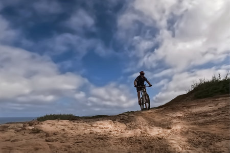 Cyclist Riding a Mountain Bike on a Rocky Trail. Extreme Sport Concept.