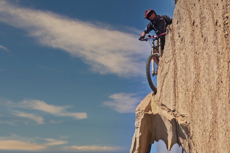 Mountain biker riding on the rocks. Extreme mountain biking.の写真素材