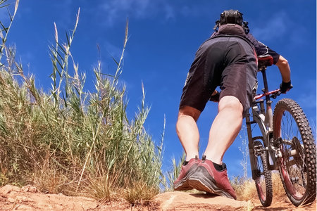 Mountain biker on a trail in the desert. Extreme sport.