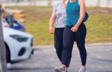 Close-up of a woman walking in a city street.の写真素材