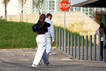 Young couple walking on the road in the city. Shallow depth of field