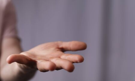 A man without head holding something without theme.
