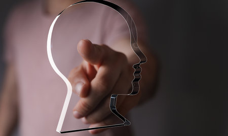 Person Pointing at Transparent Head Profile: Concept of Self-Awarenessの写真素材