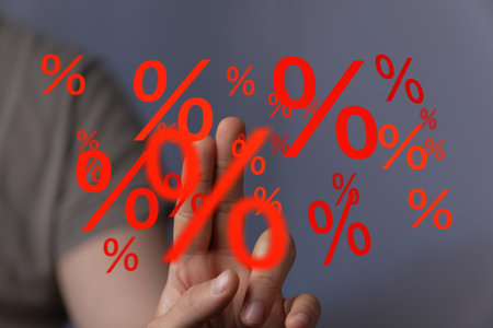 Hand Interacting with Floating Percentage Symbolsの写真素材
