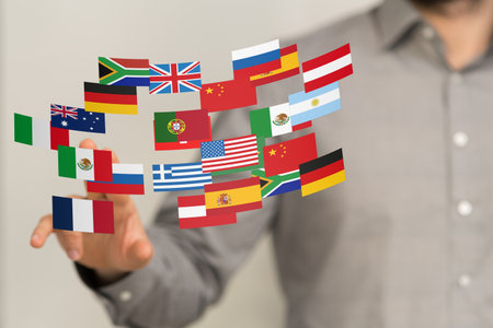 Global Business: Man Interacting with World Flags