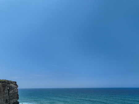 Coastline of the Atlantic ocean with blue sky in Portugal.の写真素材
