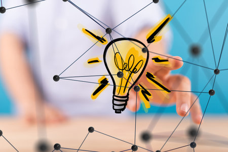 Businessman on blurred background touching floating lightbulb with his finger 3D renderingの写真素材