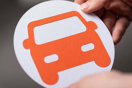 Orange Car Icon on White Circle