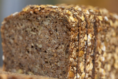 Close-up of a delicious, crusty multigrain bread loaf. Perfect for breakfast or sandwiches.