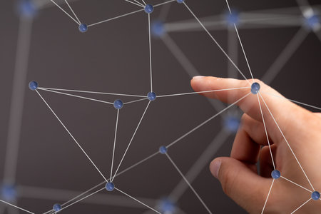 Global Network Connection: Hand Interacting with Digital Nodesの写真素材