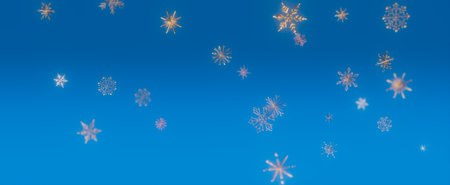 A close-up image of snowflakes falling against a blue sky, showing the beauty of winter's delicate...