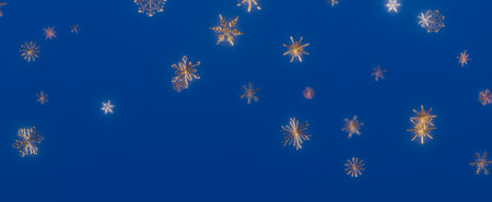 A minimalist abstract winter background with gold snowflakes falling on a blue background.の写真素材