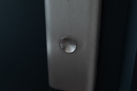 Close-up of a Metal Button on a Dark Surface